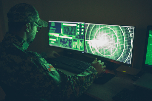 American soldier in headquarter control center American soldier in headquarter control center